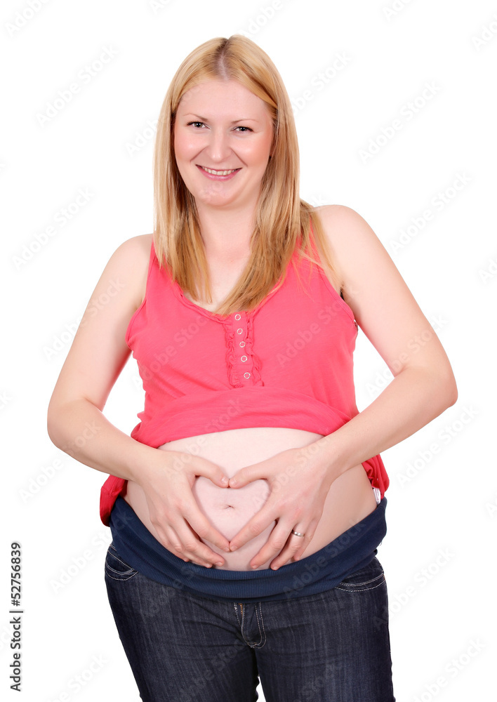 pregnant woman makes heart sign on belly pregnant woman makes heart sign on belly