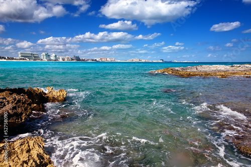 Rocky coast, the sea and city in the distance.Mexico. Cancun.