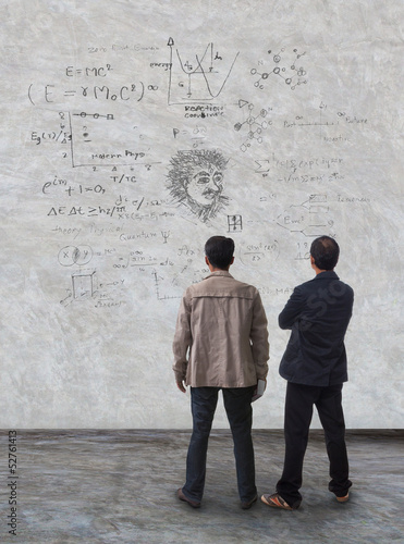 Canvas Print two man standing and watching formula on wall