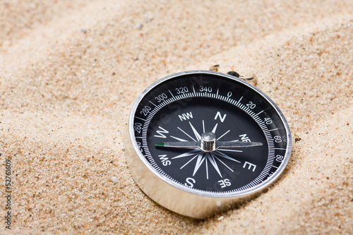 compass on the hot sand