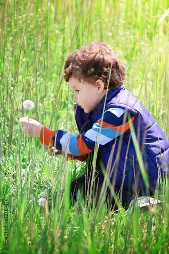 Little boy and flower.
