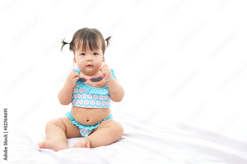 Portrait baby girl in swimsuit on white background Portrait baby girl in swimsuit on white background