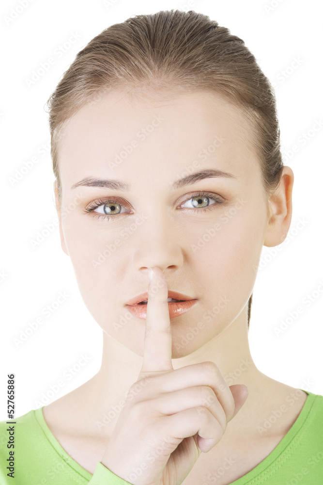 Hush be quiet woman isolated. Teen girl with finger on her lips. Hush be quiet woman isolated. Teen girl with finger on her lips.