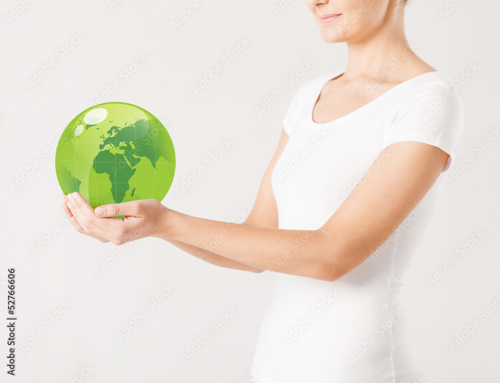 woman holding green sphere globe woman holding green sphere globe