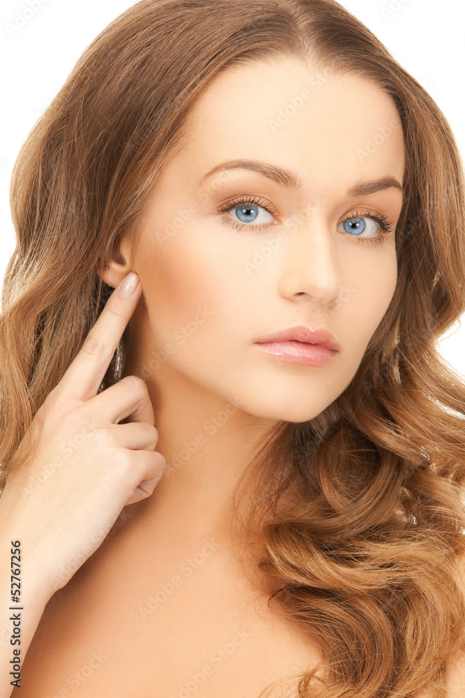 woman pointing at her face