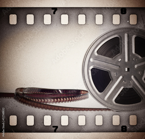 Old motion picture film reel with film strip. Vintage background #52768832