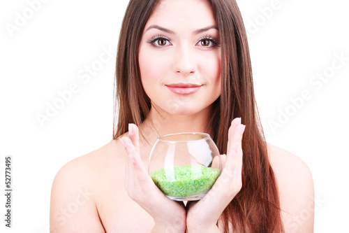 Beautiful young woman holdi...