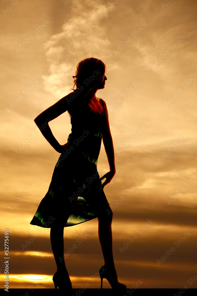 woman silhouette in sunset standing