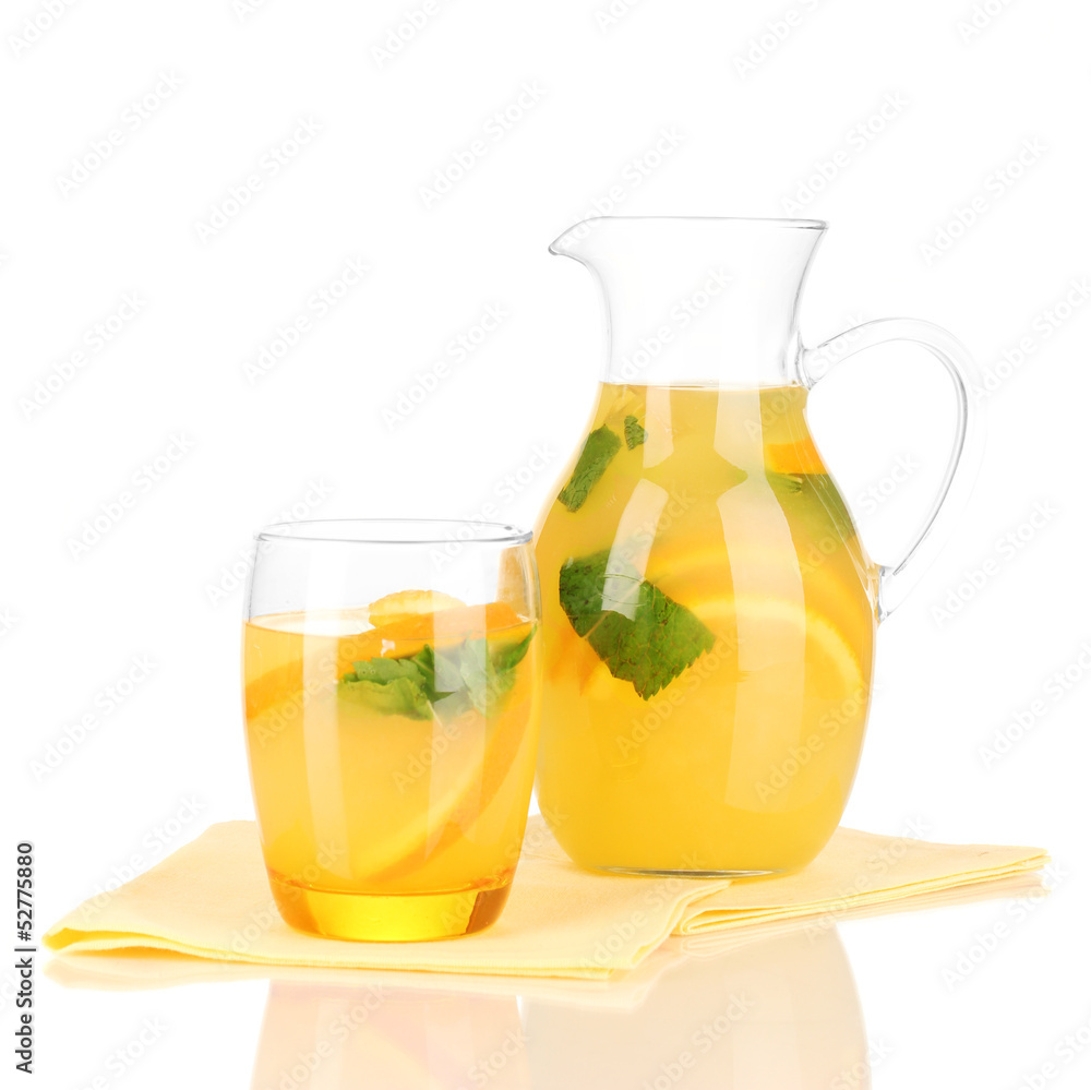 Orange lemonade in pitcher and glass isolated on white Orange lemonade in pitcher and glass isolated on white
