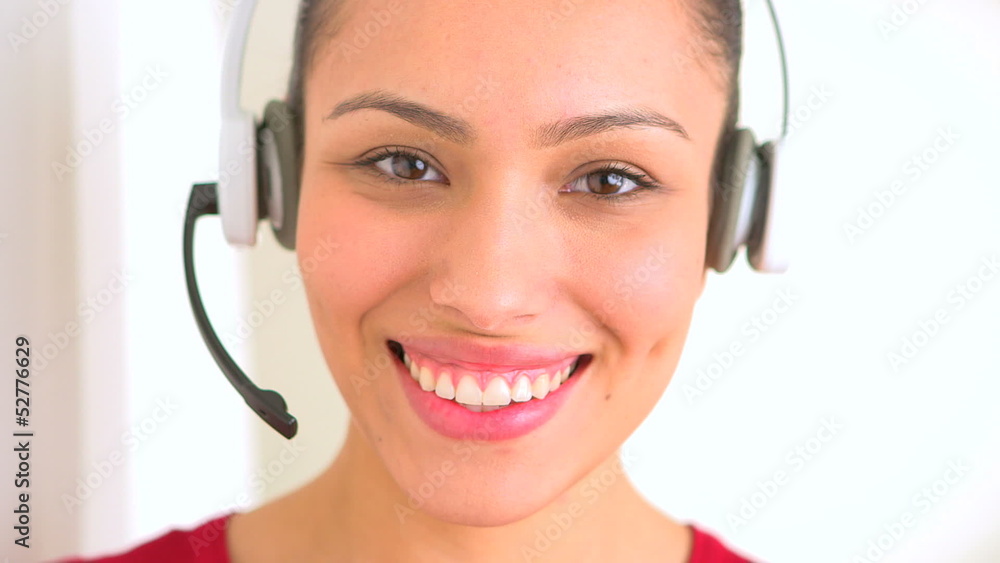 Hispanic woman with headset in customer support Hispanic woman with headset in customer support