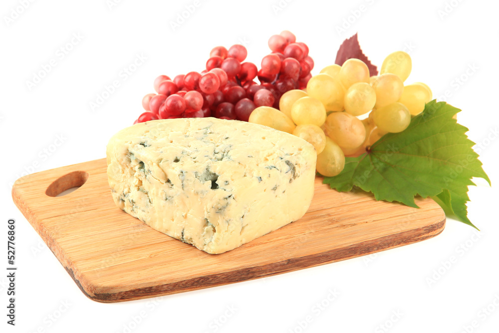 Tasty blue cheese and grape on cutting board, isolated on white Tasty blue cheese and grape on cutting board, isolated on white