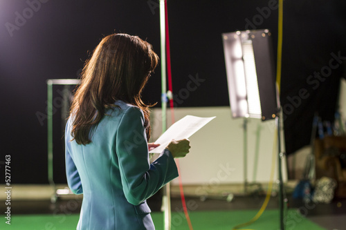Actress Holding Script Rehearsing in Set