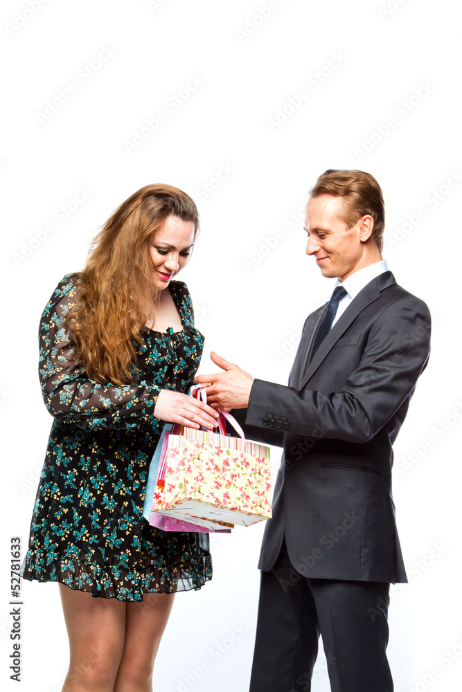 man gives a young and beautiful woman a gift man gives a young and beautiful woman a gift