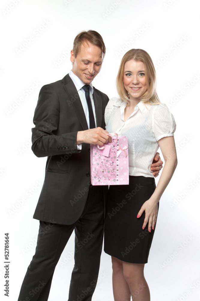 man gives a young and beautiful woman a gift man gives a young and beautiful woman a gift