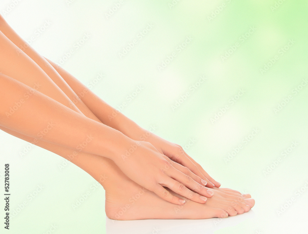 woman feet and hands on floor, blurred background