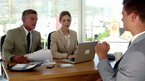 Applicant humouring the interviewers during a job interview photo