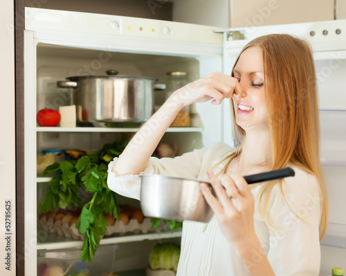 Long-haired woman holding foul food