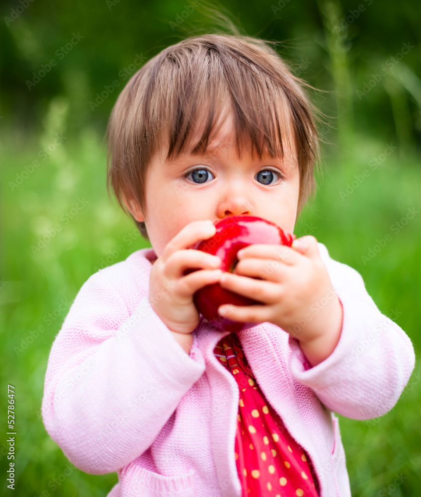 little girl eats an apple little girl eats an apple