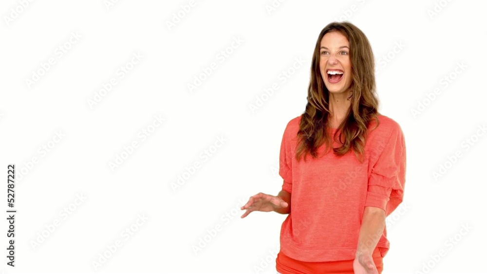 Smiling woman catching a basket ball on white background