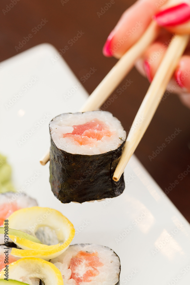 sushi with chopsticks sushi with chopsticks