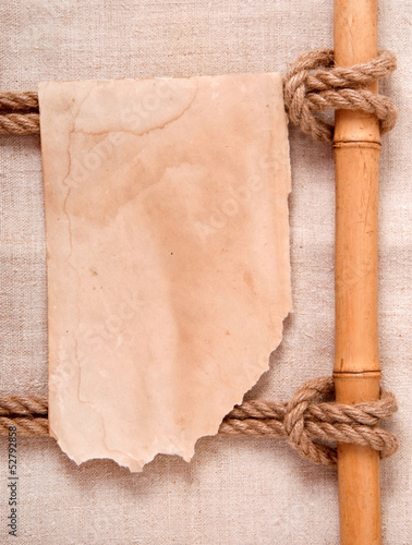 knot and old paper on the background of old cloth