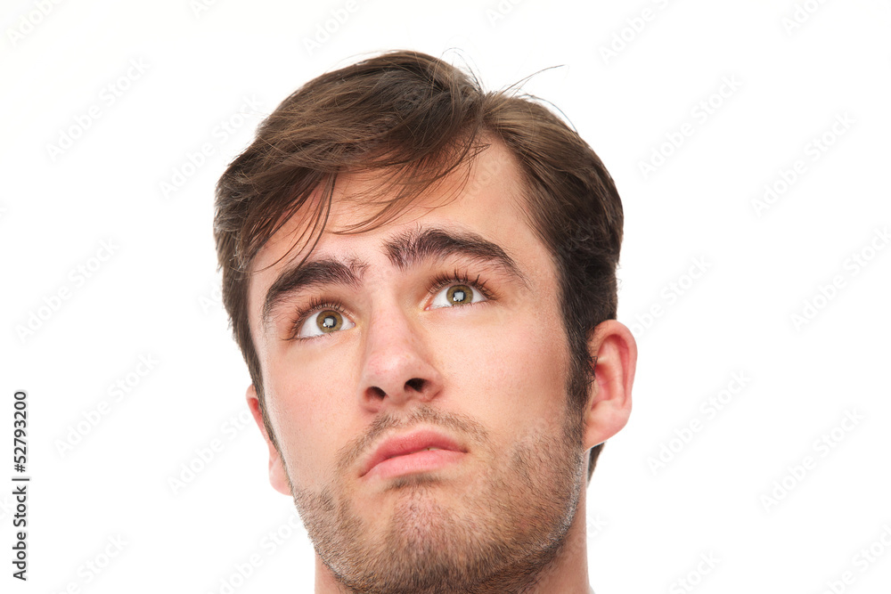 Portrait of a handsome young man looking up Portrait of a handsome young man looking up