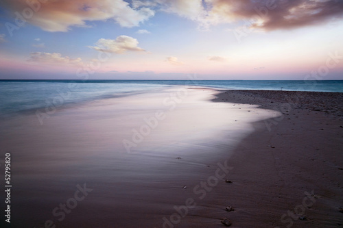 Fototapeta Naklejka Na Ścianę i Meble -  Sunset on the beach with view to the ocean and sky