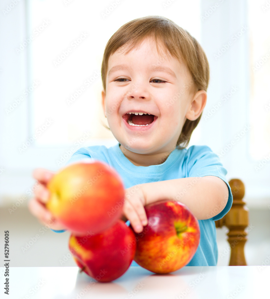 Portrait of a happy little boy with apples Portrait of a happy little boy with apples