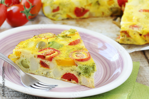 Sliced Spanish tortilla with potatoes and other vegetables