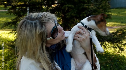 woman  happy  holding small dog Jack Russell Terrier photo