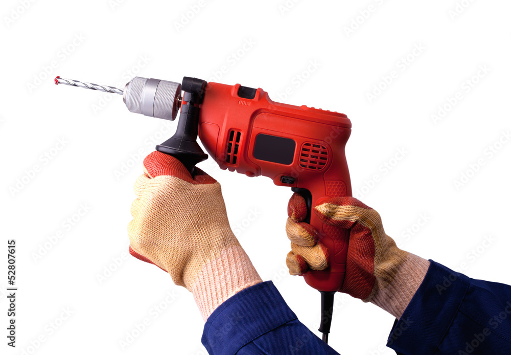 Gloved hands with electric drill Gloved hands with electric drill
