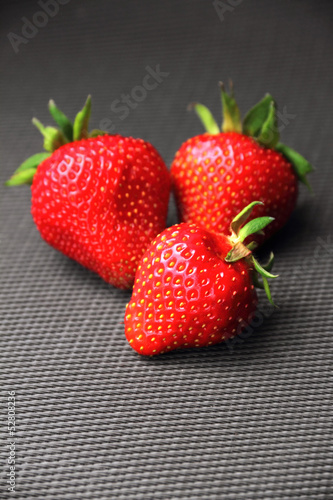 Fresh strawberry on dark grey background