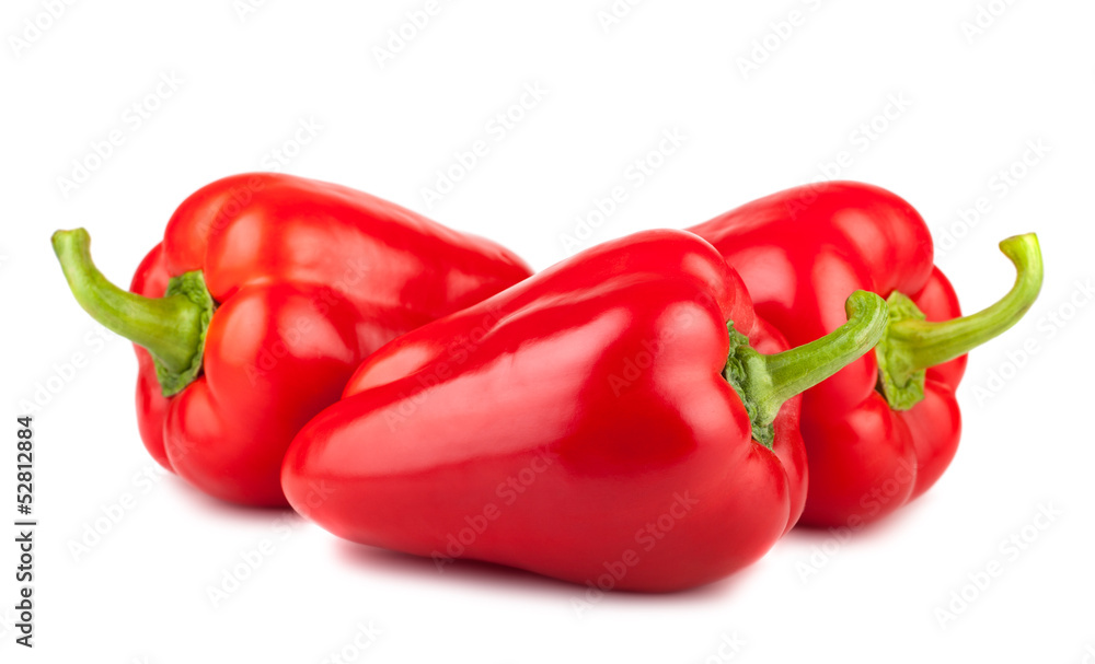 Three ripe red sweet peppers