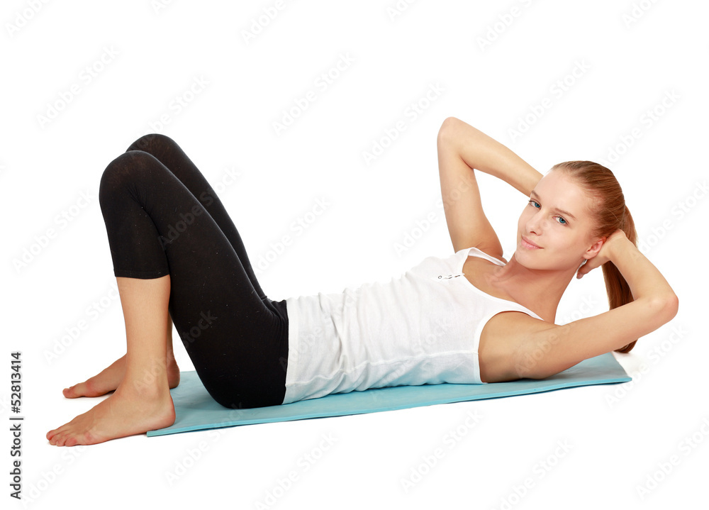 Young woman doing exercise isolated on white background Young woman doing exercise isolated on white background