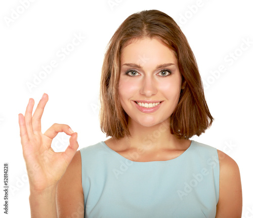 A young woman showing ok isolated on white background