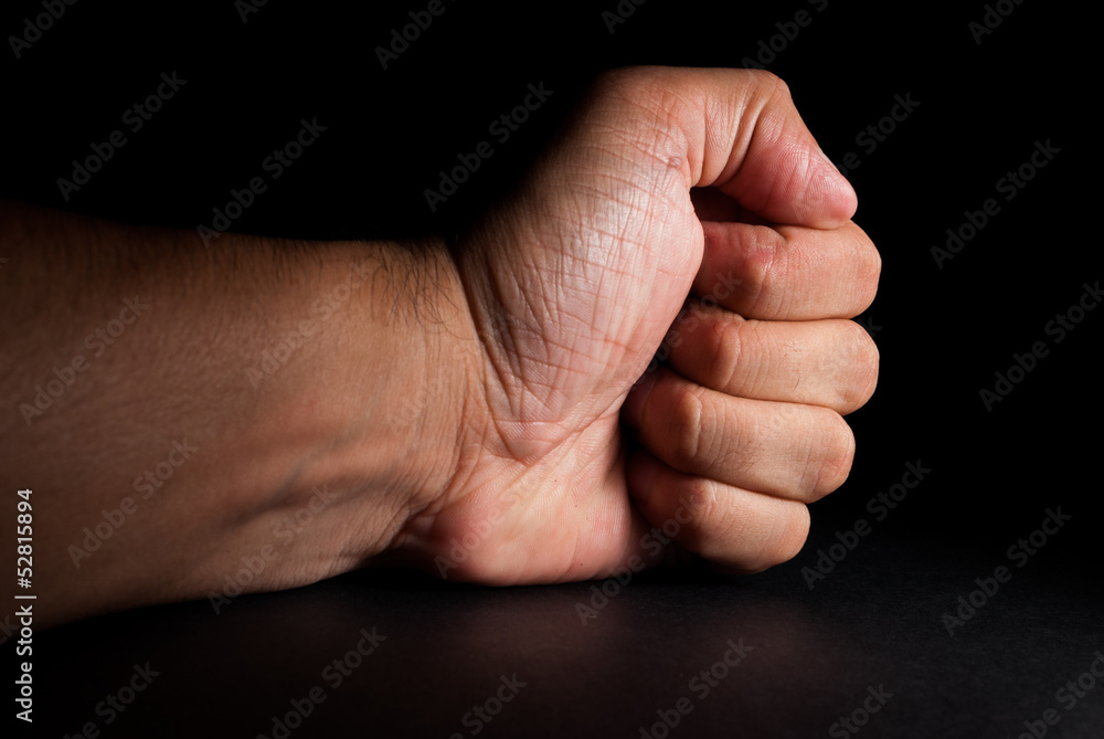 Angry man banging fist on table