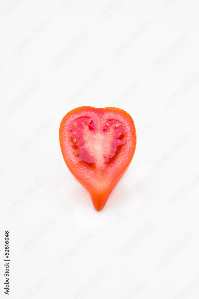 red tomato vegetable with cut isolated on white background..