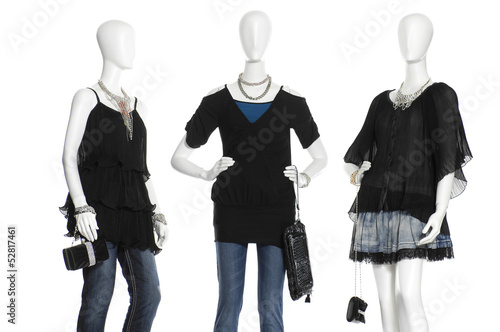 female mannequins in clothes with on white background