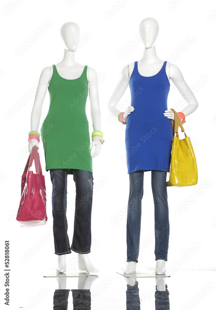 female clothing in jeans with scarf, bag on two mannequin female clothing in jeans with scarf, bag on two mannequin
