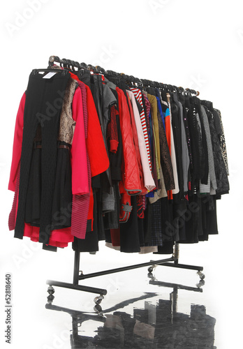 Set of female clothes hanging on clothes rack