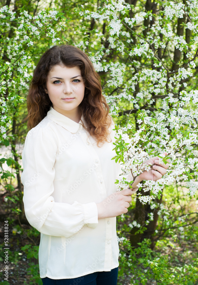 young girl in the spring garden young girl in the spring garden