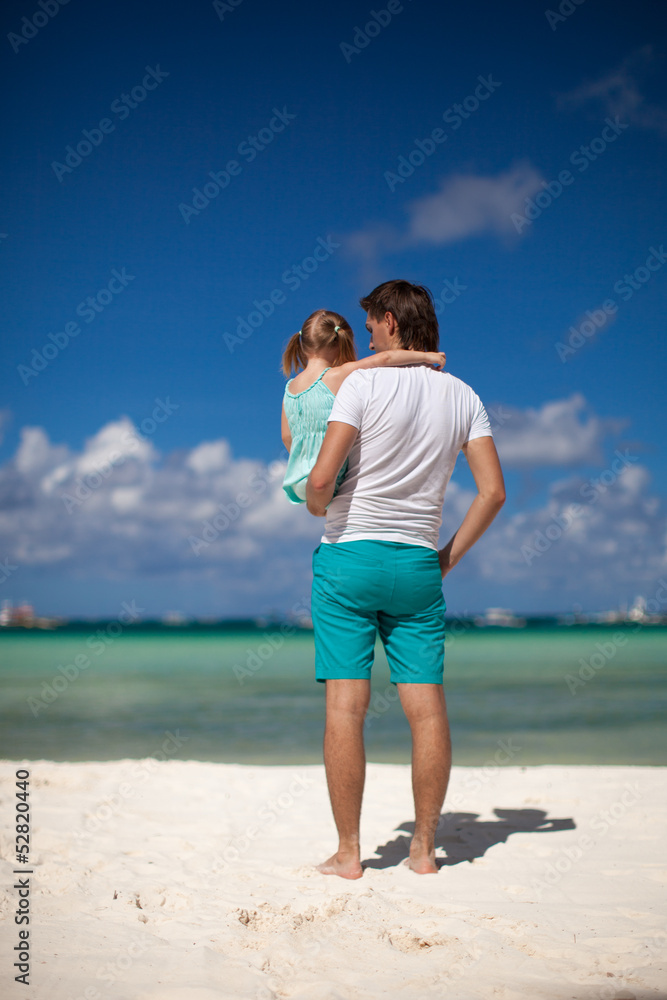 Father and his little daughter at tropical beach Father and his little daughter at tropical beach