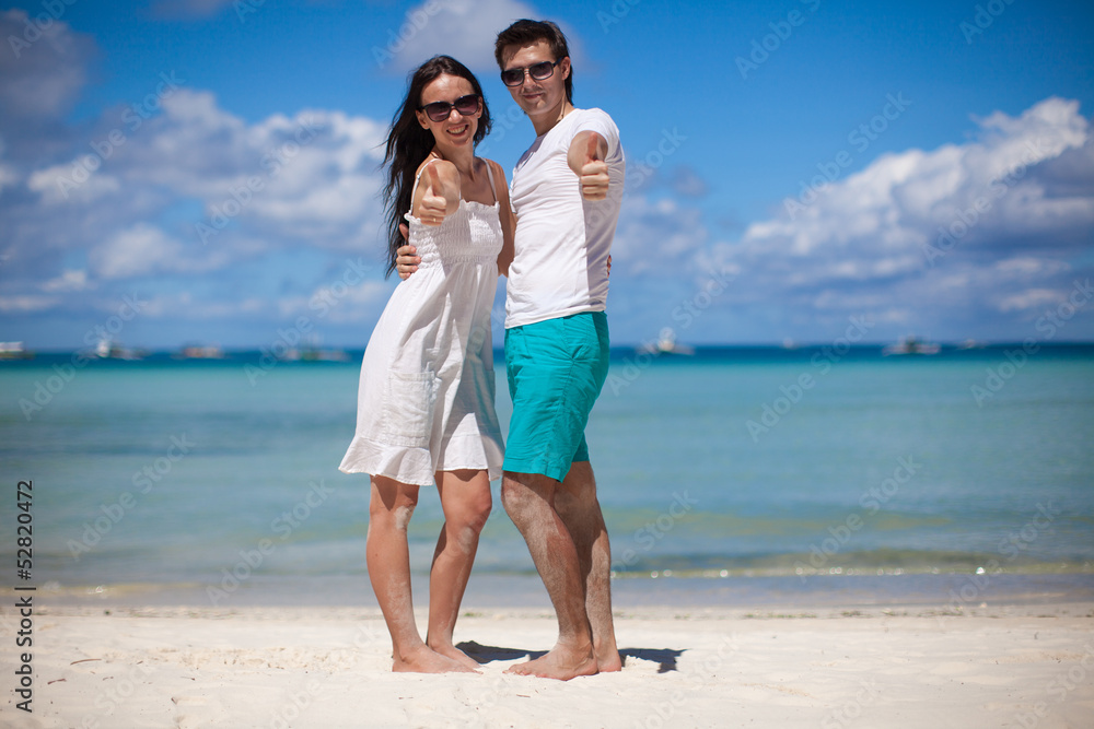 Young couple enjoying each other on a tropical beach