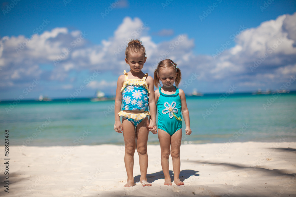 two little sisters at tropical beach in Philippines