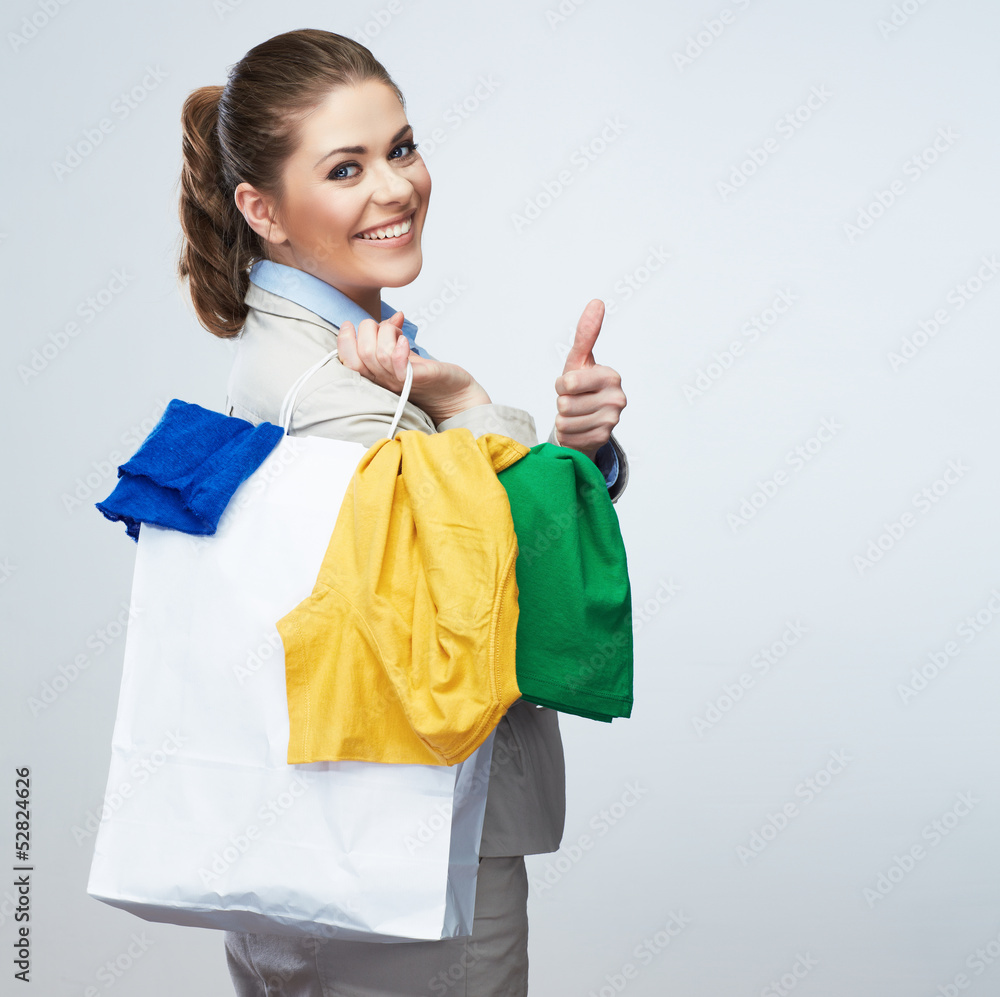 Business woman hold white shopping bag turned back. Business woman hold white shopping bag turned back.