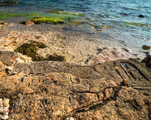 Rock carvings on the beach