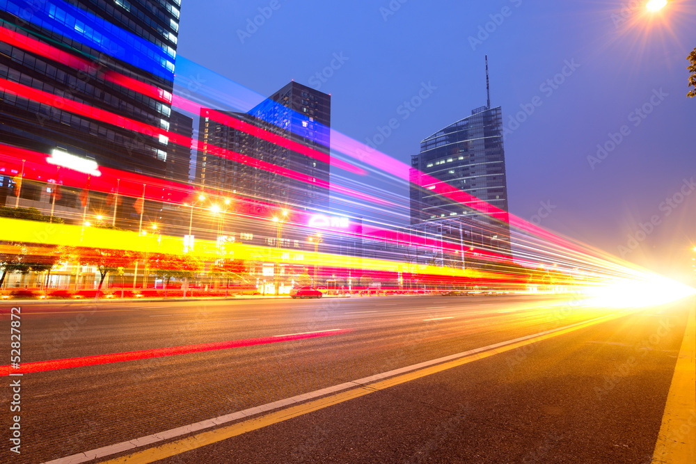 The light trails on the modern building background 