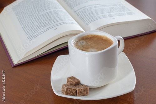 The book and cup from coffee