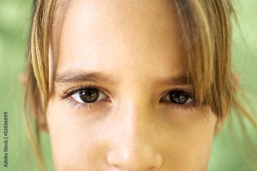 Portrait of serious young girl staring at camera Portrait of serious young girl staring at camera