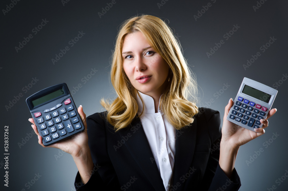 Businesswoman with calculator in business concept Businesswoman with calculator in business concept